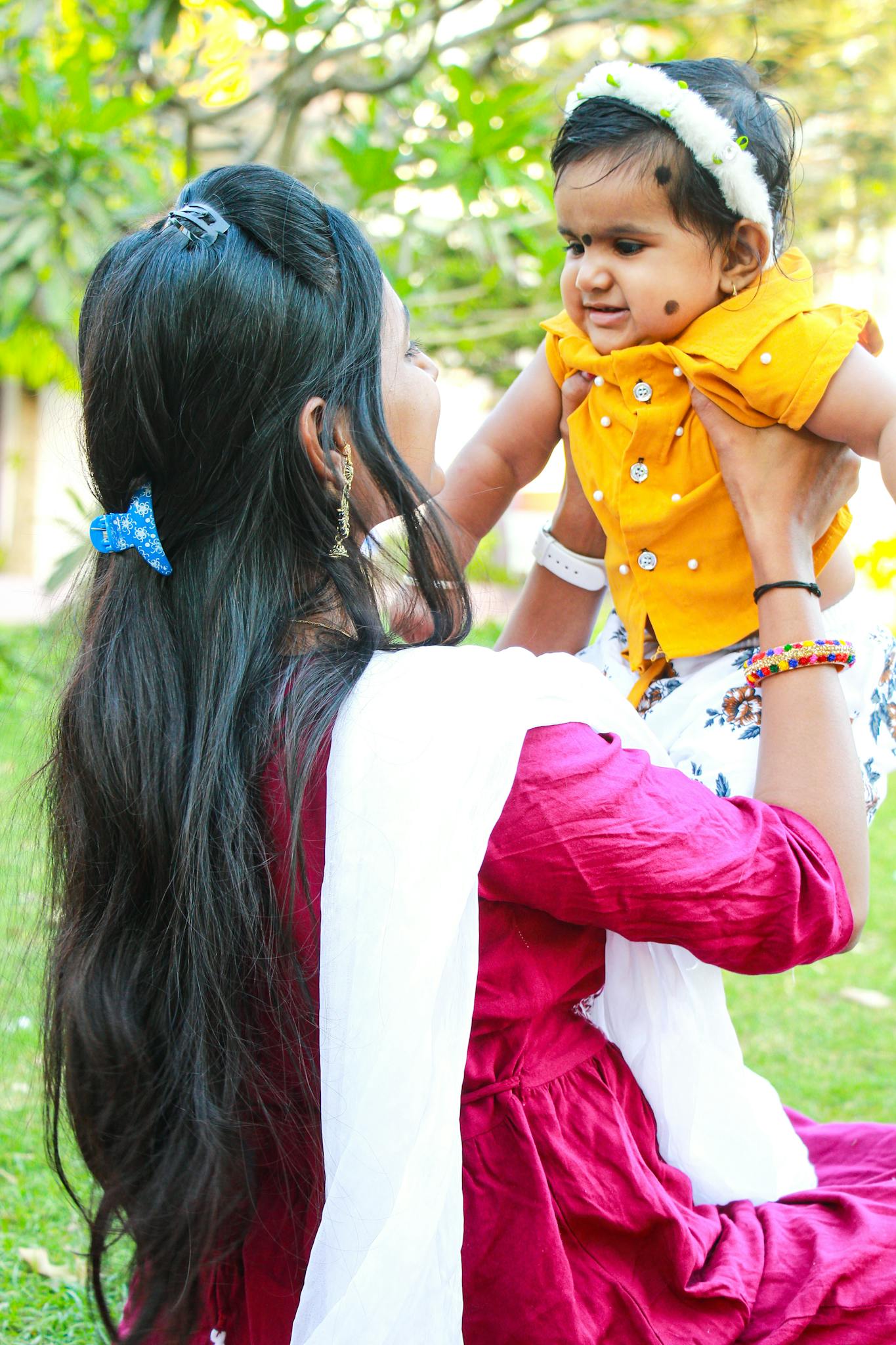 Woman Carrying Her Daughter